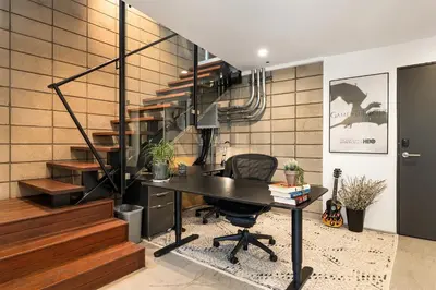 an office with a desk and a chair and stairs at Venice Rooftop 5bd 4 bt steps from the beach in Los Angeles