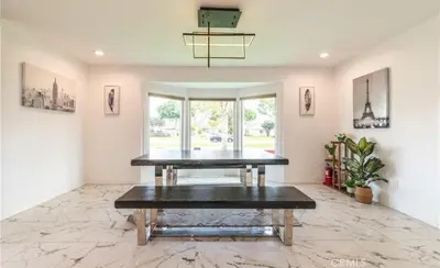 a dining room with a table on a marble floor at Modern comfort private room 1 in Los Angeles