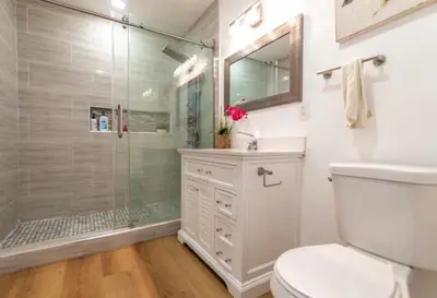 a bathroom with a shower and a toilet and a sink at Stylish Retreat Private Room 2 in Los Angeles