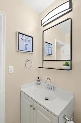 a bathroom with a sink and a mirror at Blissful Utopia near Downtown LA in Alhambra