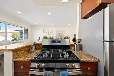 a kitchen with a stove and a counter top at Blissful Utopia near Downtown LA in Alhambra