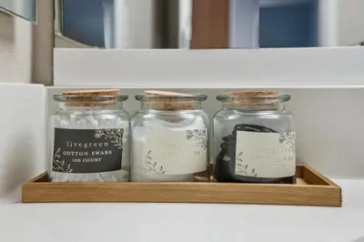 three glass jars in a wooden box in a drawer at Comfy studio near SM Promenade! Free parking! in Los Angeles