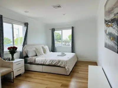 a white bedroom with a bed and a window at Contemporary Private Room 7 in Los Angeles