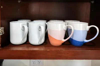 a row of coffee mugs sitting on a shelf at Idyllic Paradise Near Downtown Los Angeles in Alhambra