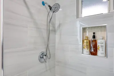a shower with a shower head in a bathroom at Idyllic Paradise Near Downtown Los Angeles in Alhambra