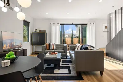a living room with a couch and a table at Rooftop 3B 3BA House Near Dodger Stadium and DTLA in Los Angeles