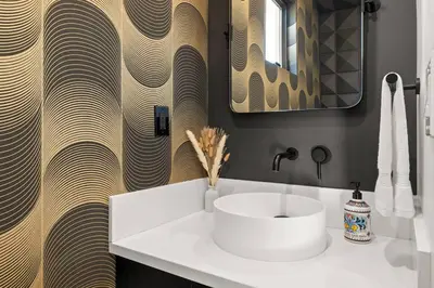 a bathroom with a white sink and a wooden wall at Rooftop 3B 3BA House Near Dodger Stadium and DTLA in Los Angeles