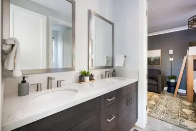 a bathroom with two sinks and a large mirror at Aspen Glen Modern Retreat in Big Bear Lake