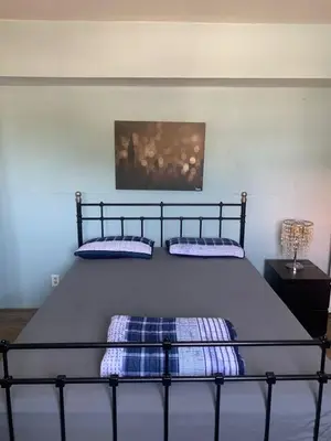 a bed with two pillows on it in a bedroom at LA Love Home in Los Angeles