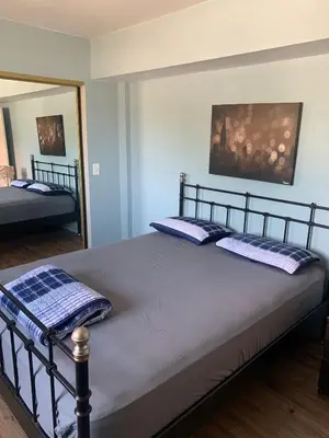 a bed with two pillows on it in a bedroom at LA Love Home in Los Angeles