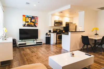 an open living room with a kitchen and a living room at Chic Large 1 Bedroom Apartment in Koreatown with Dining Area Free Gated Parking in Los Angeles