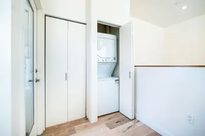 a laundry room with a washer and dryer at Nice 2 Bedroom 3 Level Loft in Central Location Close to Downtown LA Free Gated Parking Full Kitchen in Los Angeles