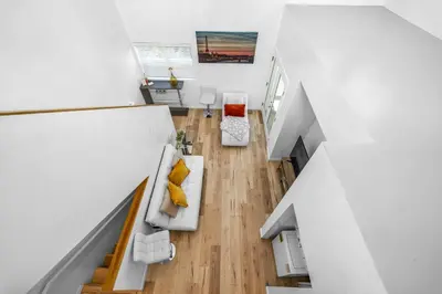 an overhead view of a living room in a house at Chic 2 Bedroom 2 Bathroom 3 Level Loft Style Condo by Hollywood Free Gated Parking Full kitchen in Los Angeles