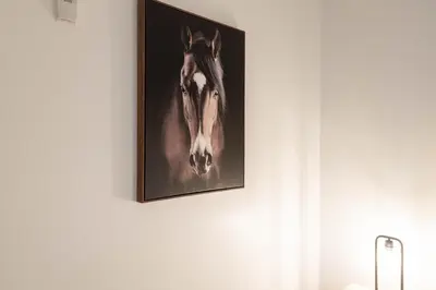 a picture of a horse on a wall at The Modern Suite Residences in Glendale