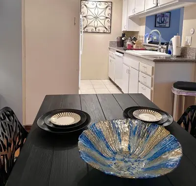 a kitchen with a table with a bowl on it at Beverly Estates in Los Angeles