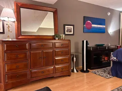 a large dresser with a mirror on top of it at Beverly Estates in Los Angeles