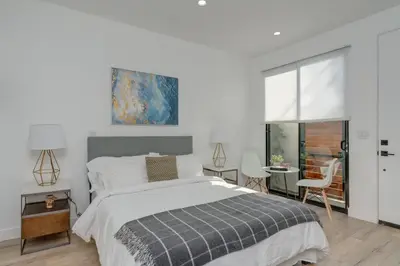 a bedroom with a bed and a table and chairs at Brand New Studio in Mar Vista in Los Angeles