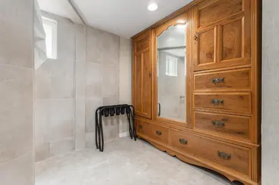 a bathroom with a wooden dresser and a cabinet at Big Pine Suite CN Lodge R#1 in Ponderosa