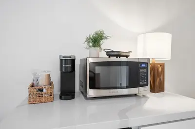a microwave sitting on top of a kitchen counter at Mountain Nook CN Lodge #4 in Ponderosa