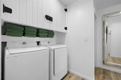 a white laundry room with a washer and dryer at Casa Lanzit - 35 Percent Off All March! in Los Angeles