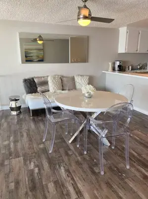 a living room with a table and chairs and a couch at OCEAN PARADISE SANTA MONICA ADJACENT 2 Bedroom in Malibu