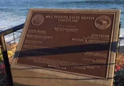 a sign for a beach with the ocean in the background at OCEAN PARADISE SANTA MONICA ADJACENT 2 Bedroom in Malibu