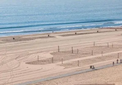 an aerial view of a sandy beach with the ocean at OCEAN PARADISE SANTA MONICA ADJACENT 2 Bedroom in Malibu