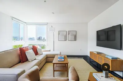 a living room with a couch and a tv at Luxurious 2Bed 2Bath Apartment at Formosa in Los Angeles