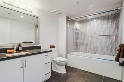 a bathroom with a tub and a toilet and a shower at Luxurious 2Bed 2Bath Apartment at Formosa in Los Angeles