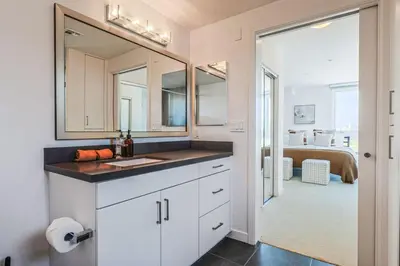 a bathroom with a sink and a mirror at Luxurious 2Bed 2Bath Apartment at Formosa in Los Angeles