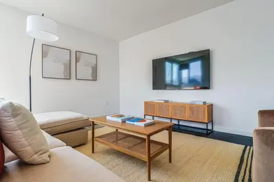 a living room with a couch and a table at Luxurious 2Bed 2Bath Apartment at Formosa in Los Angeles