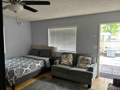 a bedroom with a couch and a bed and a couch and a bed at Private Studio GuestHouse With Everything! in Los Angeles