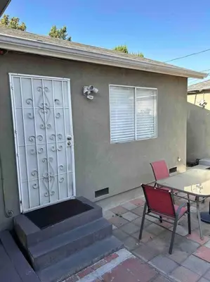 a patio with a door and a table and a table and chair at Private Studio GuestHouse With Everything! in Los Angeles