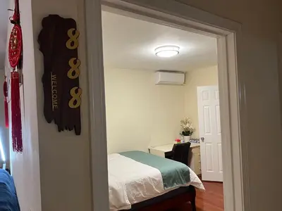 a bedroom with a bed and a sign on the wall at Alhambra\u7cbe\u54c1\u5957\u623f\u72ec\u7acb\u536b\u6d74 in Alhambra