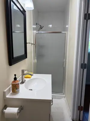 a bathroom with a sink and a shower with a mirror at Alhambra\u7cbe\u54c1\u5957\u623f\u72ec\u7acb\u536b\u6d74 in Alhambra