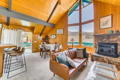 a living room with a couch and a fireplace at Frazier Park Cabin with Ping-Pong Table, Near Trails in Frazier Park
