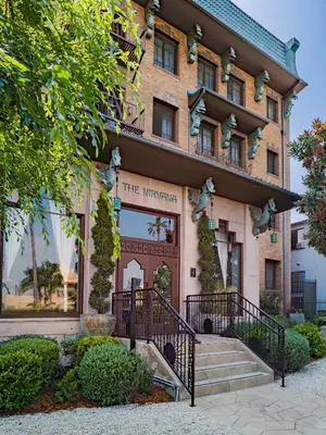 a building with a staircase in front of it at The Nirvana Apartment Hotel in Los Angeles