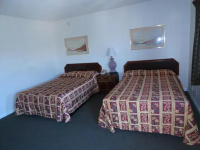 a hotel room with two beds in a room at Travel Inn in North Hills
