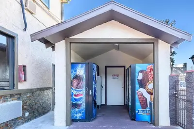 a building with two refrigerators in front of it at Sea Rock Inn - Los Angeles in Los Angeles