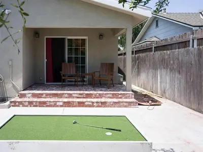 a house with a golf ball on a putting green at Family Renovated Home, Netflix, AC, WD, Putt Putt in Fullerton
