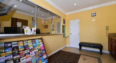 a store with a counter and a bench in a room at Americas Best Value Inn & Suites Los Angeles Downtown SW in Los Angeles
