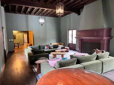 a living room with couches and a fireplace at Westholme Park - Female Only in Los Angeles