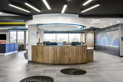 a lobby with a reception desk in a building at Tru by Hilton Norco Eastvale in Norco