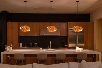 a kitchen with wooden cabinets and a large kitchen island at The Bella Villa Venice Beach - luxury interior design - spa and terrace in Los Angeles