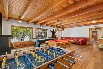 a living room with a pool table and ping pong tables at Big Bear Lake Sleep 16 in Big Bear Lake