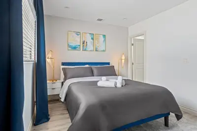 a bedroom with a bed with two towels on it at Luxury Oasis in Culver City! Free parking and Jacuzzi in Los Angeles