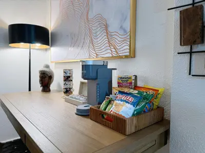 a desk with snacks on it in a room at Cozy 2B1B Apt Prime Location Newly Remodeled in Alhambra
