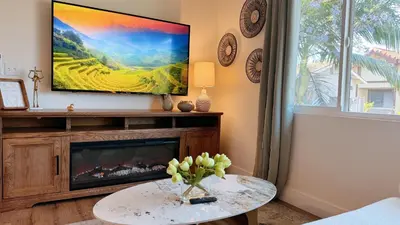 a living room with a tv and a fireplace at Cozy 2B1B Apt Prime Location Newly Remodeled in Alhambra