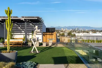 a balcony with a statue on top of a building at The Sapphire Nest - Spectacular Rooftop Amenities Ocean views 2BR in Los Angeles