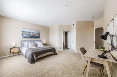 a bedroom with a bed and a desk in it at Spacious 3-Bedroom 3BTH Apt in Marina Del Rey! Pool, Hot Tub in Los Angeles